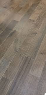 Straight From The Showroom Floor One Of Our Favorite Wood Look Tiles Is Woodker Brown It S The Perfect Mi Wood Look Tile Brown Porcelain Tiles Grey Wood Tile