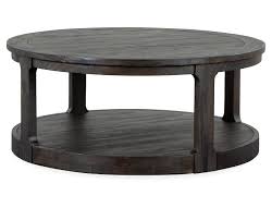 A coffee table is a low table designed to be placed in a sitting area for convenient support of beverages, remote controls, magazines, books (especially large, illustrated coffee table books), decorative objects, and other small items. Bainbridge Coffee Table Furniture Row