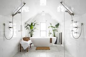 Blue and white tiles in a shower are a classic combination, lending themselves traditionally to a nautical theme. 20 White Bathrooms That Give Sleek A New Meaning Lonny