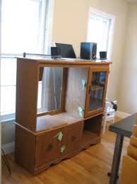 The very clever erin of sutton grace blog had taken a 2nd hand tv entertainment unit and turned it into a mini kitchen for her little girl. Diy Play Kitchens Popsugar Family
