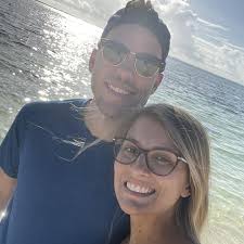 This is a bird. In a see thru backpack. In a coffee shop. It is tweeting,  chirping, and squawking.