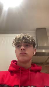 Red Hoodie Performance in Bright Kitchen Setting