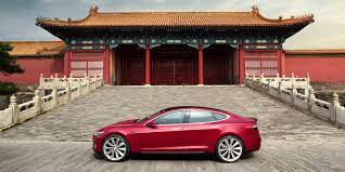 A visitor tries the tesla model x at the recent china international import expo in shanghai. Tesla Increases Price Of Model S And Model X By Over 20 000 In China Due To New Trade War Tariffs Electrek