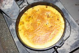 A can of peach pie filling, a can of sprite soda and a box of yellow cake mix. Dutch Oven Peach Cobbler Barbequelovers Com