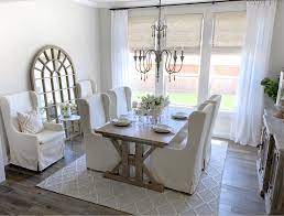 In this dining room, a triple wide window was dressed with custom draperies on each side. Guide To Ordering And Installing Window Coverings In Your Home My Texas House