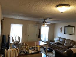 Young man sitting on the windowsill make video call on the phone. Small Living Room Front Door In The Middle