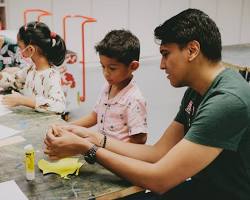 Image of Family taking an arts and crafts workshop in Nigeria