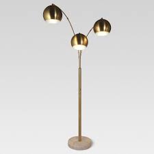 As elegant as it is useful, this metal floor lamp features a white shade and stand that beautifully blend with any home decor style. Brass Floor Lamps Standing Lamps Target