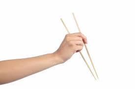 First, pick up a single chopstick, sandwiching it between your thumb and your index finger, as you would a pen. An Introduction To Japanese Chopstick Etiquette