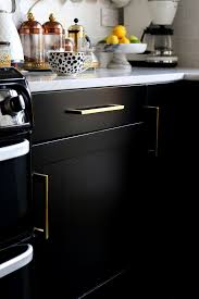 Painting kitchen cabinets that aren't working for you is easier than ripping them out and replacing the banks of drawers and shelving. Painting Our Kitchen Cupboards Black Swoon Worthy