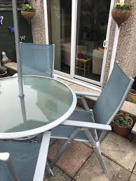 A nice garden is only half the fun if you can't sit there with friends and family on summer days, or even nights, to have a yarn and a bite from the barbecue. Patio Table 4 Folding Chairs And Umbrella In S40 Chesterfield For 40 00 For Sale Shpock