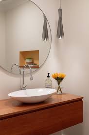 Shop for round lighted vanity mirror online at target. Powder Room Features A Floating Vanity With A Vessel Sink A Round Mirror And An Eclectic Hanging Light Fixtures Hgtv