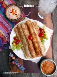 Everything (recipe included) is put into a 9x13 baking dish and baked at 400 degrees for 25 minutes. Cheesy Chicken Flautas Baked Or Fried Sumptuous Spoonfuls