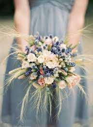 White wedding flowers embody purity, innocence, and romance. Rose Wheat And Lavender Bouquet Thistle Wedding Flowers Wedding Flower Inspiration Wedding Bouquets