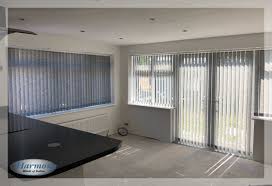 grey vertical blinds in patio doors and