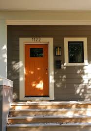 Putty Cream With Orange Door Exterior House Colors Orange Front Doors Exterior Paint Colors For House