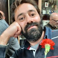 How do particles become entangled, enabling "spooky action at a distance"?