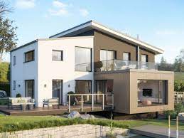 Floor to ceiling windows bring the spectacular setting to the interior of the home. Concept M 170 V S 2 Jpg Haus Grundriss Haus Hanglage Pultdachhaus