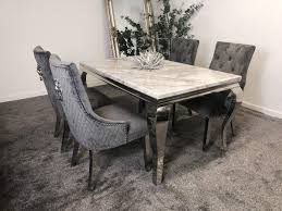 The smooth and sophisticated lines of mirrored dining furniture, combined with the robust and reliable design is sure to bring life and vibrancy to your dining room. Schwarze Furniture Imperial Grey Marble Mirrored Dining Table With 4 Lion Back Knocker Chairs Set Buy Online In Colombia At Desertcart Co Productid 179912139