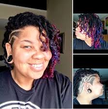 Colorful locs and designed shaved side.