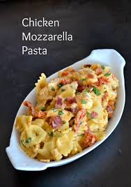 Farfalle Pasta Tossed With Some Seasoned Cooked Chicken Tenders Sundried Tomatoes And Bacon In A Crea Pasta Dishes Chicken Mozzarella Pasta Mozzarella Recipes