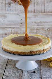 Sprinkle the white chocolate chunks evenly over the filling; White Chocolate Cheesecake With Macadamia Nuts And Caramel Taste And Tell