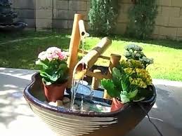 A shishi odoshi breaks the quietness of a japanese garden with the sound of a bamboo rocker arm hitting a rock. Shishi Odoshi Fountain Japanese Deer Chaser Fountain Video Dailymotion