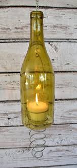 Melted wine bottle candle holder, one of a kind! Diy Hanging Wine Bottle Candles Party Wedding Backyard Fairy Lights