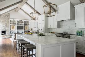 White kitchen, red ceiling with white beams, dark countertops, white topped light green island. Remodeled White Kitchen With Vaulted Ceiling Beams Home Bunch Interior Design Ideas