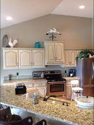 Whitewash the walls, floor or brick in your family room to create a vintage feeling. Cabinet Paint Color Silver Pointe Unsure Of Glaze Color Wall Color Urban Putty Sherwin Williams Kitchen Cabinet Colors Kitchen Remodel House Colors