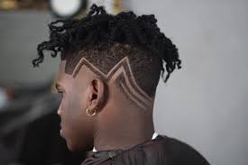 Whether you choose a warm tone or platinum blonde, the lightness next to dark skin is a truly flattering so, this cut goes to all guys who are not afraid to stand out in the crowd with this bold line which separates the top portion from the sides. Best 22 Latest Good Looking Black Men S Haircuts 2019