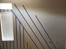 When you're deciding where and how to paint stripes, you should pick between horizontal or vertical stripes, and then you can mark the design on the wall with tape and begin. How To Paint The Perfect Striped Accent Wall Kayla Simone Home