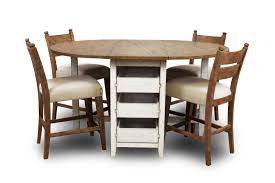 The trisha yearwood 5 piece dining room set features trisha's trestle table that has a beautiful brown finish with heavy distressing and burnishing that creates an uneven relaxed appearance to reflect years of wear and tear. Trisha Yearwood Home Collection By Klaussner Coming Home Dining Table 4 Pub Height Chairs Ruby Gordon Home Dining 5 Piece Sets