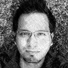 Reflections of Trees and Buildings in a Puddle