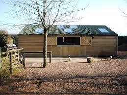 This arrangement allows you to work in the barn, clean stalls, feed, etc inside during inclement weather. American Barns Bespoke Equestrian Buildings American Barn Jon William Stables Uk American Barn Equestrian Building Barn Layout