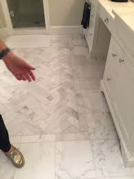 Herringbone Pattern Inset Surrounded By 12x12 White Carrara Floor Tiles Bathroom Floor Tile Patterns Patterned Floor Tiles Floor Tile Patterns Entryway