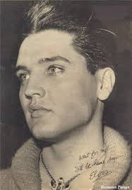 1957 Elvis spends his first Christmas at Graceland with his family