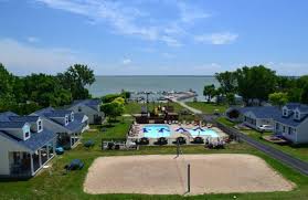 Two floors that include 1.5 bathrooms, a living room, dining area, small kitchenette and a bedroom with a king size bed. Best Beachfront Lodge In Ohio South Beach Resort