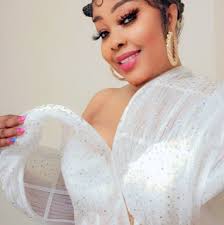 Outfit by Darasang Couture. Fabric by: Ema Udoh Gele (Green) by: Ini Umoren  Gele (Orange) by: Rhoda Michael Ufot .