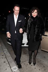 One of holm's later girlfriends, kathy wardlow, said in 1988 that holm revealed to her he had only married joan for her money, and that he had been unfaithful throughout the marriage because she was old and wrinkled. percy gibson. Joan Collins And Percy Gibson At Craig S In West Hollywood Celebmafia