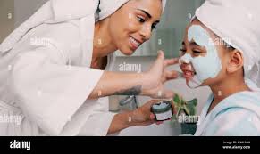 Mom, daughter and home skincare face mask of family bonding together with a  house spa day. Mama and girl with beauty treatment, facial serum and skin  Stock Photo - Alamy