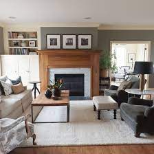 Turquoise chairs break up the neutrals, as does a colorful accent pillow on the sofa. Beautiful Gray Living Room Ideas