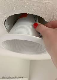 A recessed light bulb lies flush with the ceiling or other surface, making it nearly impossible to grab some recessed led light fixtures can be pulled directly out of the ceiling. How To Update Old Recessed Lights To Led Thrifty Decor Chick Thrifty Diy Decor And Organizing