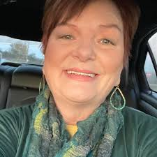 I need help with this brick wall in the family room, it overwhelmes me when  I look at it. Thinking about white washing but do not know how to decorate  it. Thank