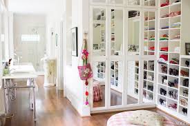 Separate his and her closets are located on either side of a. Closet Bathroom Combo Design Ideas