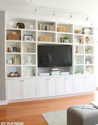 Built In Bookshelves Styling And Storage Tips Diy Playbook Living Room Entertainment Center Living Room Entertainment Living Room Built Ins