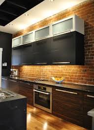 A brick wall in the kitchen is both timeless and trendy. Kitchen Brick Backsplashes For Warm And Inviting Cooking Areas
