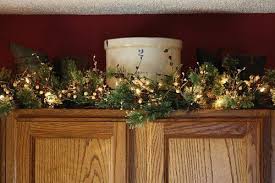 Currently mine has vintage still life oil paintings. Christmas Decorating Above Kitchen Cabinets Christmas Photos