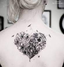Maybe you would like to learn more about one of these? Cute Heart In The Center Of Girl S Back Made Up Of Flowers With Little Dragonflies Flying Aro Heart Tattoo Designs Dragonfly Tattoo Design Heart Flower Tattoo