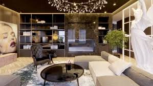 The grey background color of this living room perfectly lets the colors of the decor items pop up. Luxury Eclectic Living Room Allwall Interior